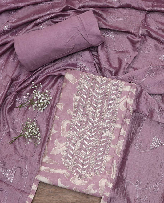 Lavender material chudidar set, uniquely printed with neck self color thread embroidered top, plain bottom and sequins embroidered dupatta