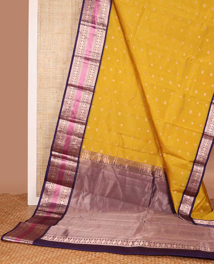 Yellow zari buttas silk saree, contrast border of thilakam,kathir, rudraksham, and mayil kann, and jaal pallu