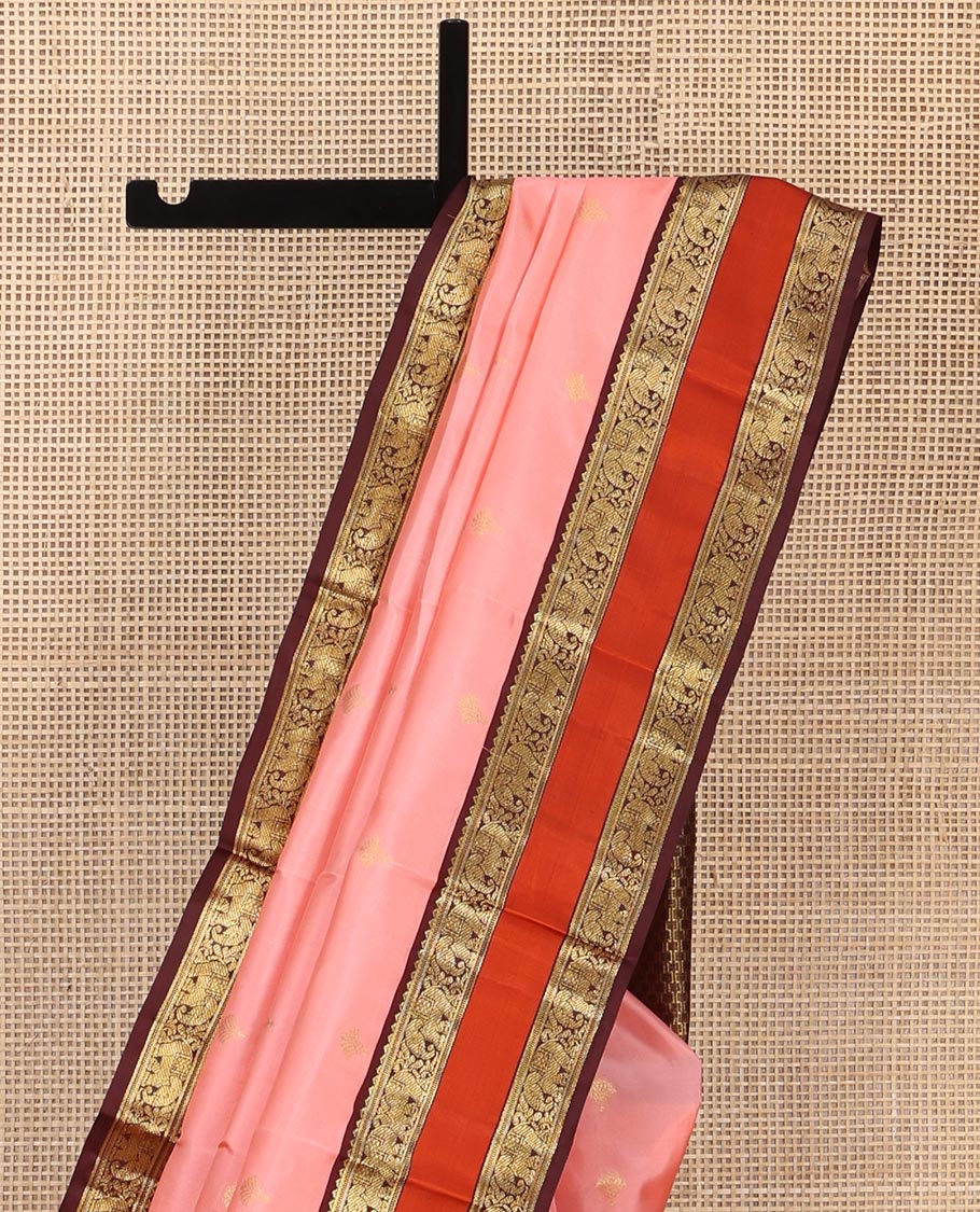 Pink Vasundhara Silk Saree, Sparsely Sparkled with Zari Buttas All Over Its Body, Complemented by a Contrast Rettai Pettu Border of Rekku, Muthu, and Yaanai Designs, Grand Geometric Pallu, and Paired with a Contrast Blouse