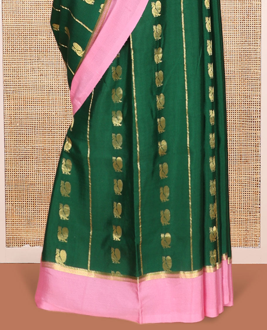 Green Mysore Silk Saree, Adorned With Zari Stripes and Peacock Buttas Across Its Body, Complemented by Captivating Contrast Border of Traditional Zari Designs, Pallu Steeped with Traditional Zari Designs, and Paired with a Contrast Blouse