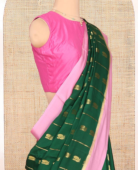 Green Mysore Silk Saree, Adorned With Zari Stripes and Peacock Buttas Across Its Body, Complemented by Captivating Contrast Border of Traditional Zari Designs, Pallu Steeped with Traditional Zari Designs, and Paired with a Contrast Blouse