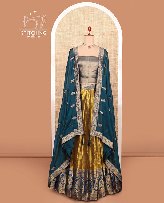 Gold-blue zari buttas half-saree with contrast intricate motifs woven bordered skirt, brocade blouse, and a zari design dhavani