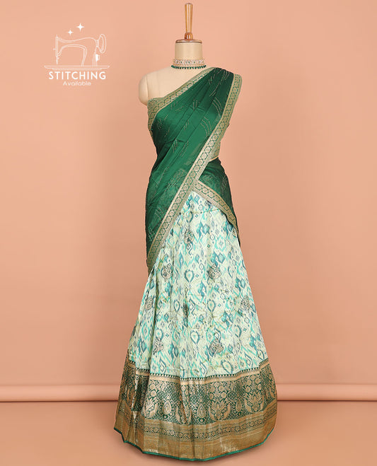 Green ikkat design art silk half saree, contrast traditional design border, jacquard blouse & stone work dhavani