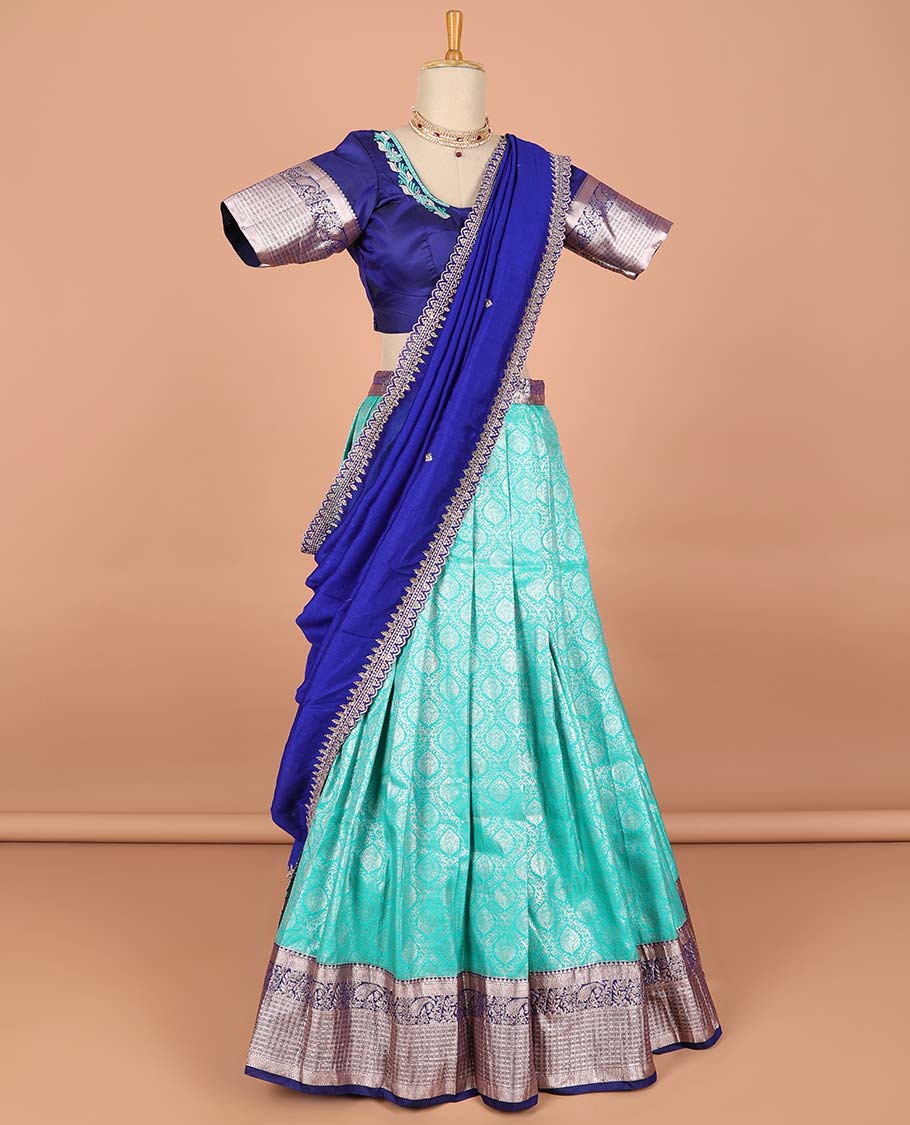 Green ogee jacquard semi-stitched half saree with contrast zari border,  embroidered blouse & scallop border dhavani
