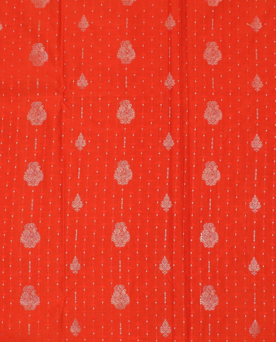 Orange art silk pavadai material, zari buttas with embossed contrast traditional zari border skirt, and matching blouse