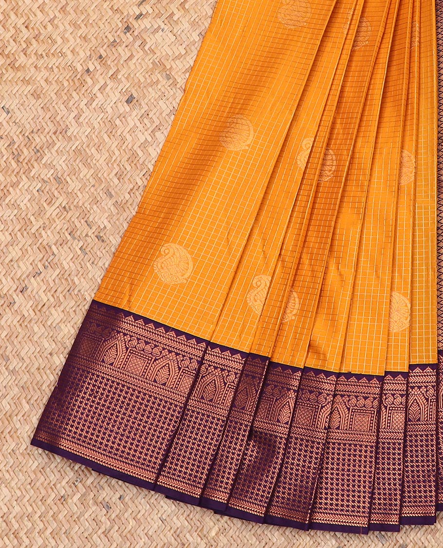 Orange paisley buttas enclosed checked gift saree, contrast traditional zari design border, and jaal pallu