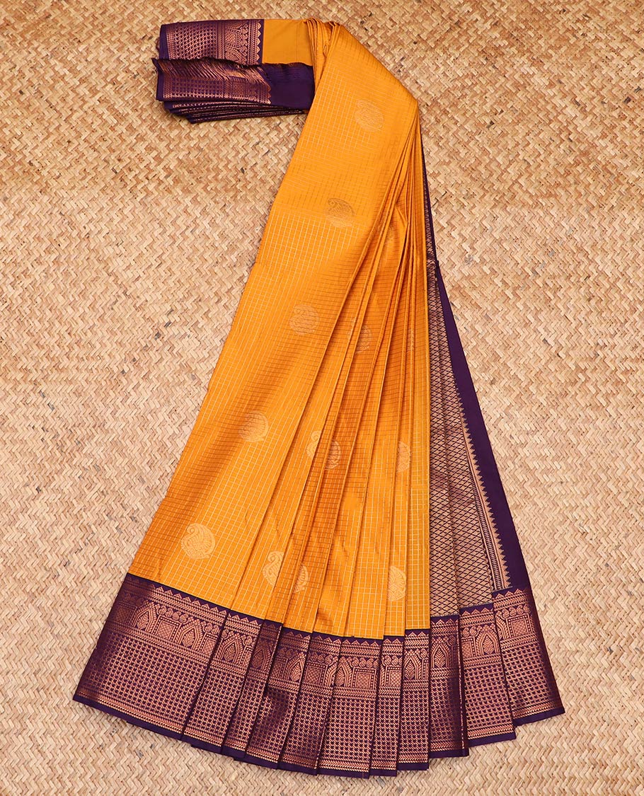 Orange paisley buttas enclosed checked gift saree, contrast traditional zari design border, and jaal pallu