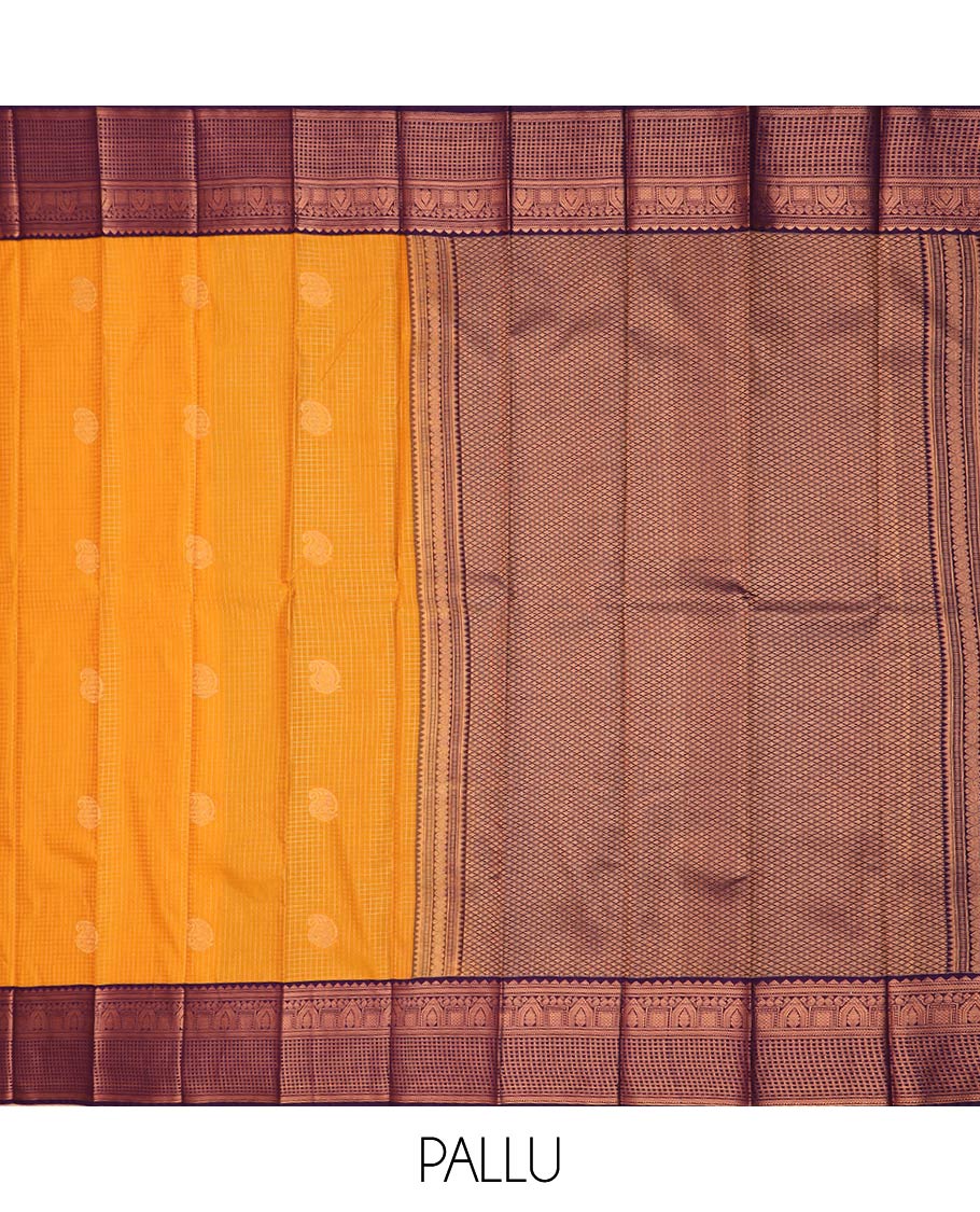 Orange paisley buttas enclosed checked gift saree, contrast traditional zari design border, and jaal pallu