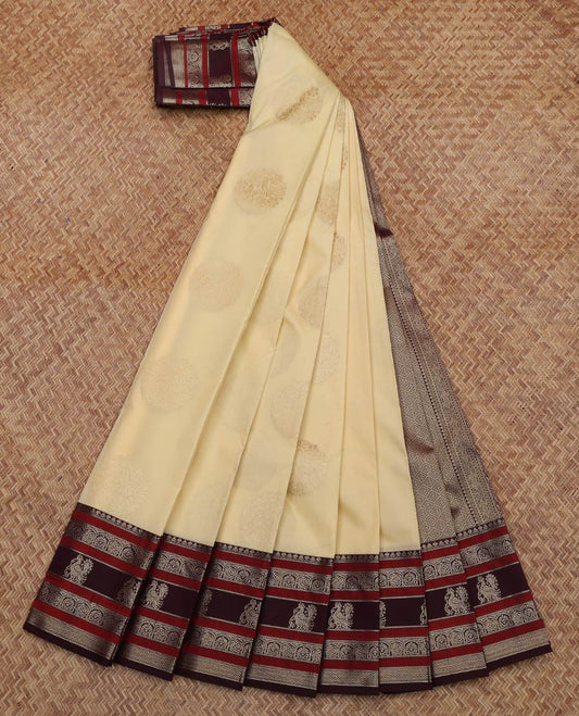 Cream Budget Silk Saree, Sparsely Woven with Buttas All Over Its Body, Complemented by Contrast Traditional Zari Designs Woven Border, Grand Jaal Pallu and Paired with a Contrast Blouse