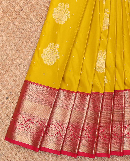 Yellow Budget Silk Saree, Enthralled with Buttas All Over Its Body, Complemented by a Contrast Traditional Zari Design Border, Pallu Delicately Woven with Ogee Designs, and Paired with a Contrast Blouse