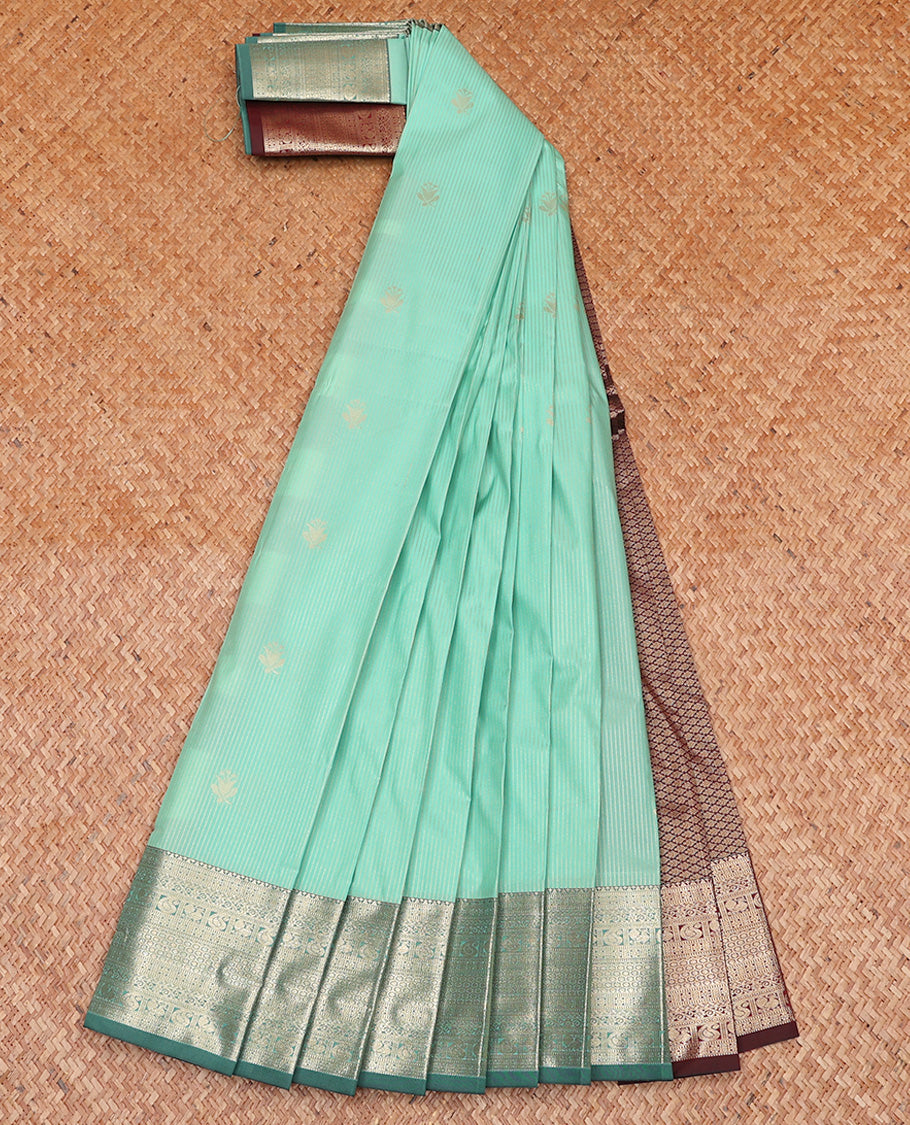Pale Green Budget Silk Saree, Sparsely Sparked with Zari Buttas and Stripes All Over Its Body, Highlighted by Contrast Traditional Zari Designs Woven Border, Grand Contrast Jaal Pallu and Paired with a Contrast Blouse
