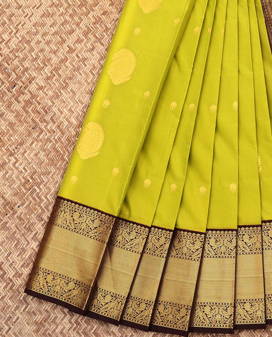 Green Budget Silk Saree, Subtly Sparkled with Zari Buttas All Over Its Body, Complemented by a Contrast Traditional Zari Border of Peacock Designs, Grand Jaal Pallu, and Paired with a Contrast Blouse