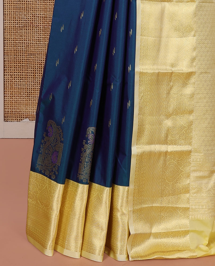 Blue Budget Silk Saree, Prettied with Zari Buttas and Corner Paisley Buttas on Its Body, Complemented by a Contrast Traditional Zari Designs Woven Border, Pallu of Geometric Designs, and Paired with a Contrast Blouse