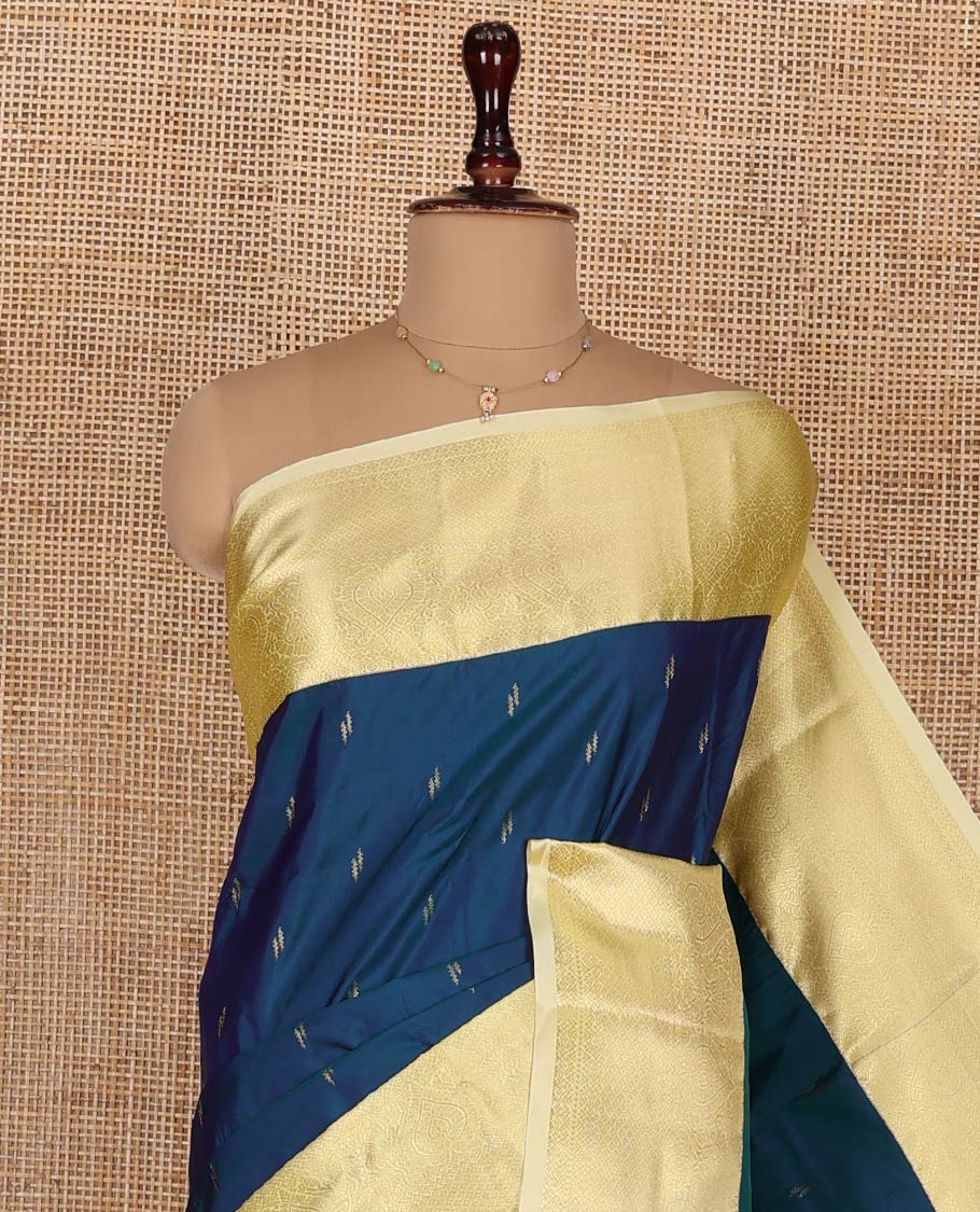 Blue Budget Silk Saree, Prettied with Zari Buttas and Corner Paisley Buttas on Its Body, Complemented by a Contrast Traditional Zari Designs Woven Border, Pallu of Geometric Designs, and Paired with a Contrast Blouse