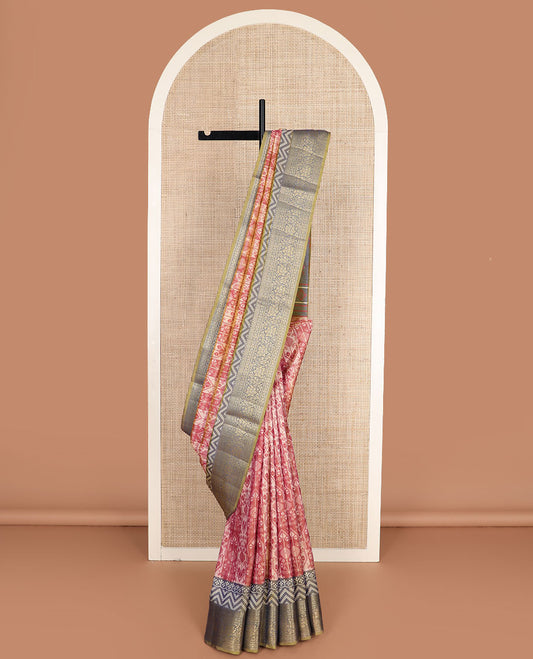 Dark peach intricately designed semi-banaras patola silk saree, contrast floral creeper zari design border, and pallu of chevron and floral designs