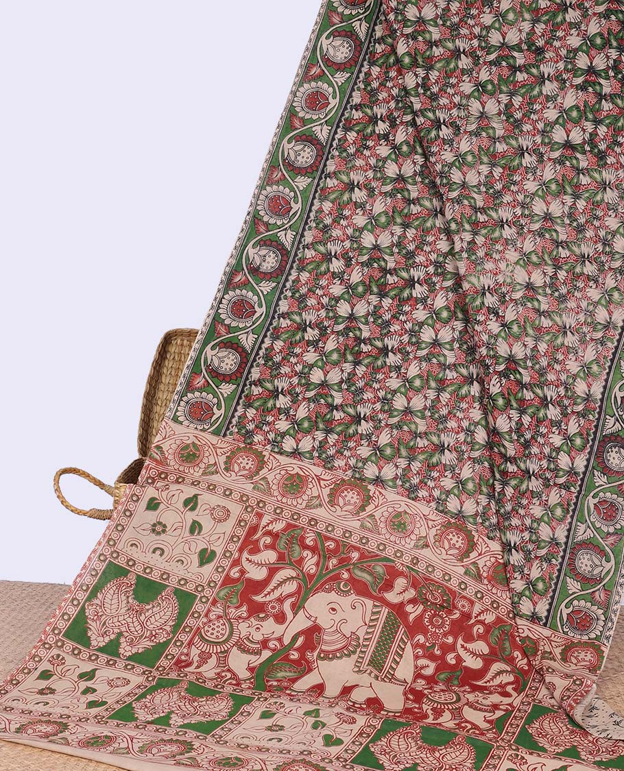 Multi-coloured floral vine design machine-printed kalamkari cotton saree with contrast floral border & animal, paisley motifs pallu