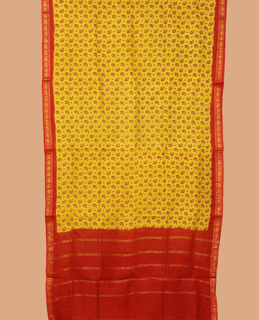 Yellow paisley buttas nine-yard cotton saree, contrast peacock zari border, and striped pallu