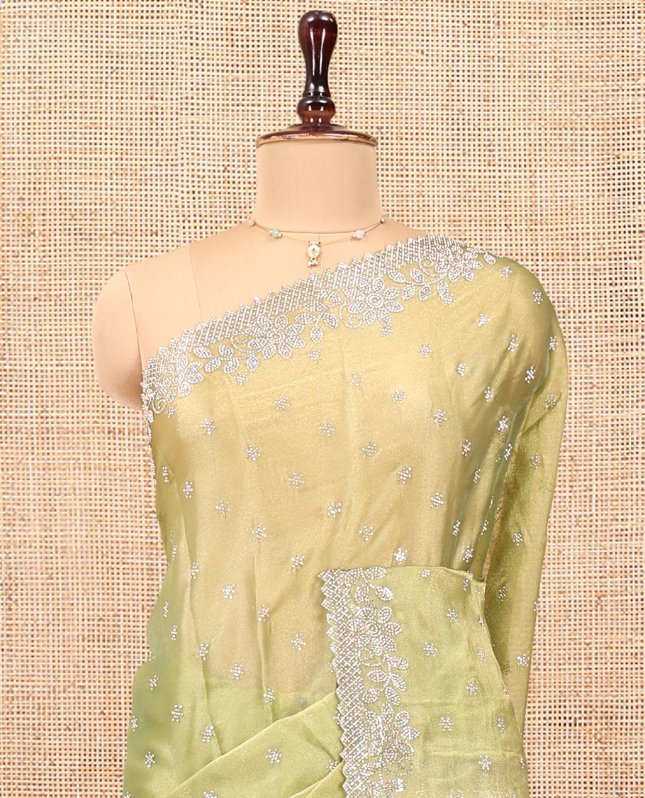 Green Designer Saree, Gleamed up with Stone Work All Over Its Body, Highlighted by Stone Embroidered Border, And Paired with a Matching Blouse