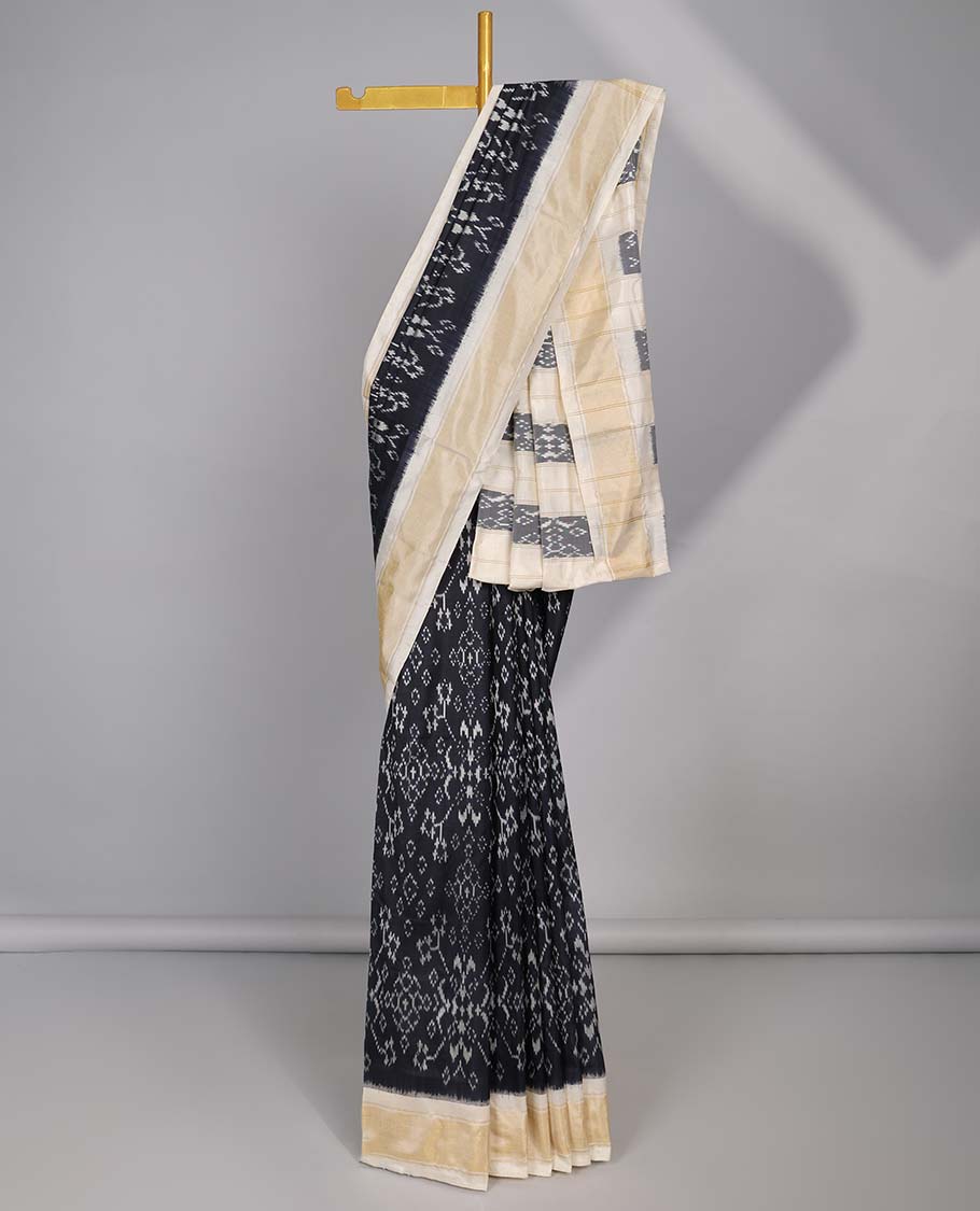 Black intricate floral design ikkat silk saree with contrast plain border & striped , intricate design pallu