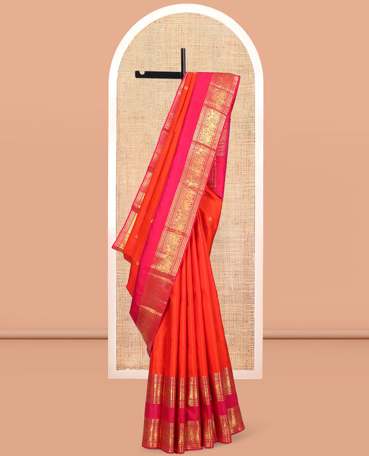 Orange Kanchipuram Silk Saree, Detailed with Zari Buttas, Complemented by Contrast Border of Banaras, Kamalam, and Yaanai Designs, Zari Woven Pallu, and Contrast Blouse