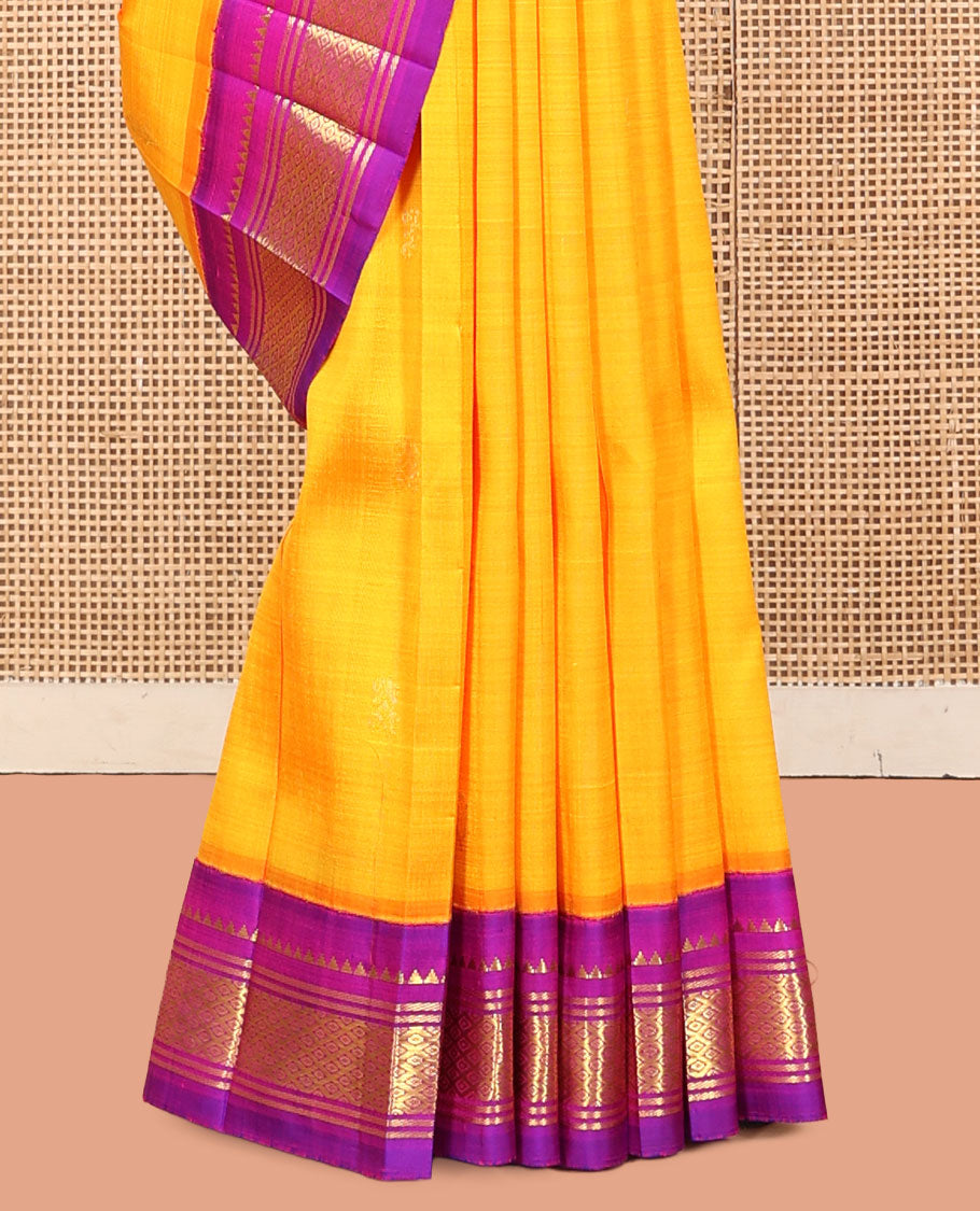 Yellow Kanchipuram Silk Saree, Delicately Woven with Zari Buttas, a Contrast One-Sided Korvai Border of Rekku, Banaras, and Jaal Designs, a Zari Design Pallu, and No Blouse