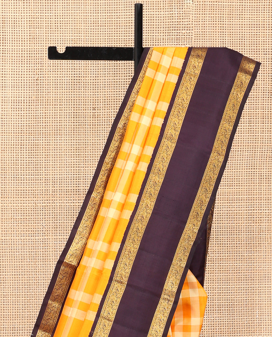 Orange Checked Kanchipuram Silk Saree, Complemented by a Contrast Korvai Rettai Pettu Border of Mayil Designs, Zari Striped Pallu, and a Contrast Blouse
