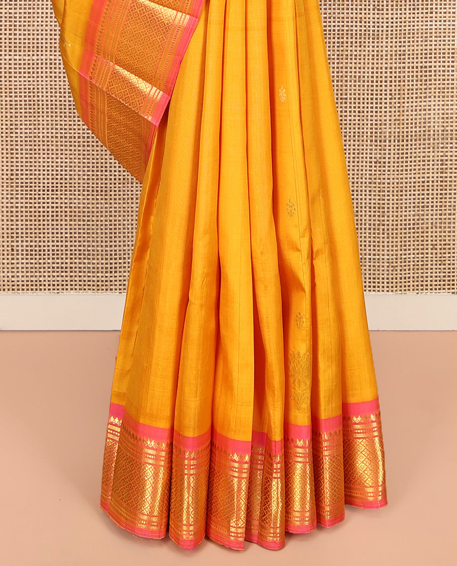 Orange Kanchipuram Silk Saree, Subtly Woven with Zari Buttas, Complemented by Contrast One-Sided Border of Thilakam Mokku, Banaras, Muthu, and Jaal Designs, Zari Design Pallu, and No Blouse
