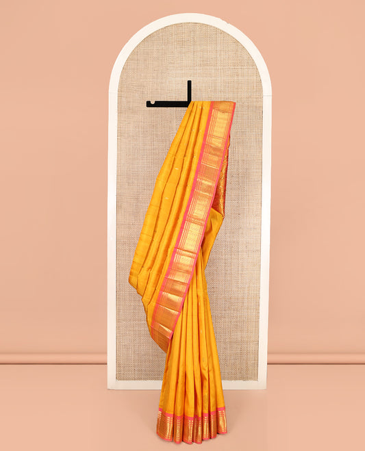Orange Kanchipuram Silk Saree, Subtly Woven with Zari Buttas, Complemented by Contrast One-Sided Border of Thilakam Mokku, Banaras, Muthu, and Jaal Designs, Zari Design Pallu, and No Blouse