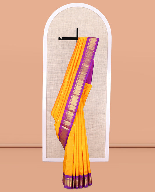 Yellow Kanchipuram Silk Saree, Gleamed Up with Zari Buttas, a Contrast Korvai Border of Thilakam Mokku, Banaras, and Jaal Designs, Zari Woven Pallu, and No Blouse