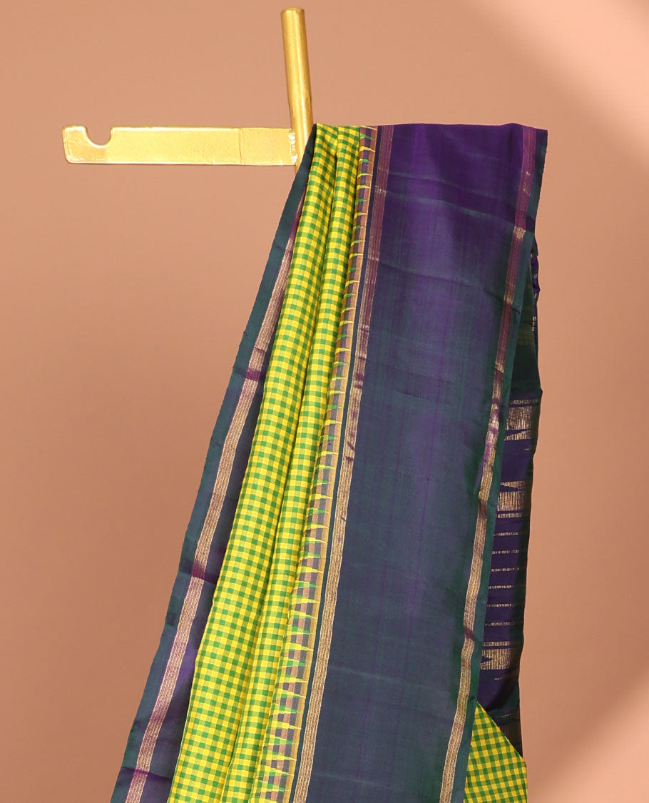 Green checked kancheepuram silk saree with contrast striped border & striped zari pallu