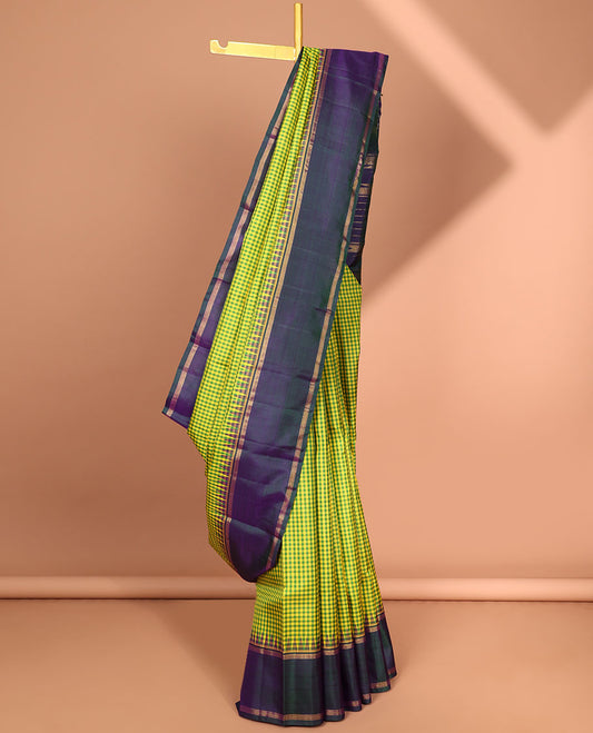 Green checked kancheepuram silk saree with contrast striped border & striped zari pallu