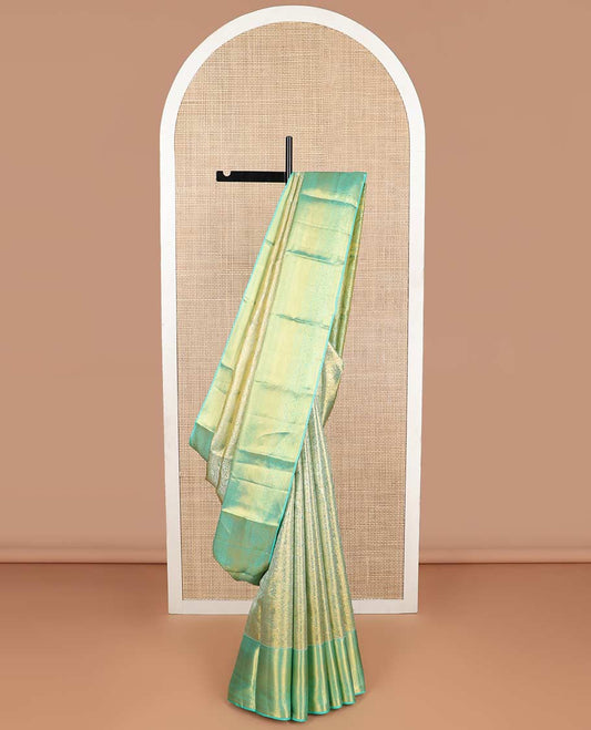 Light floral jacquard kancheepuram tissue silk saree with contrast border of thilakam mokku, banaras, vanki, mayil kann design & zari design pallu