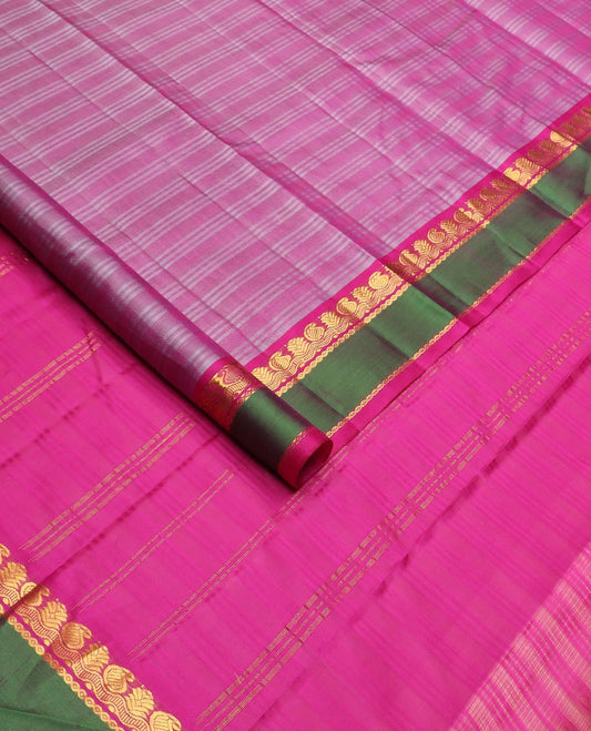 Pink striped Kanchipuram silk saree, contrast rettai pettu border of zari designs, and zari striped pallu