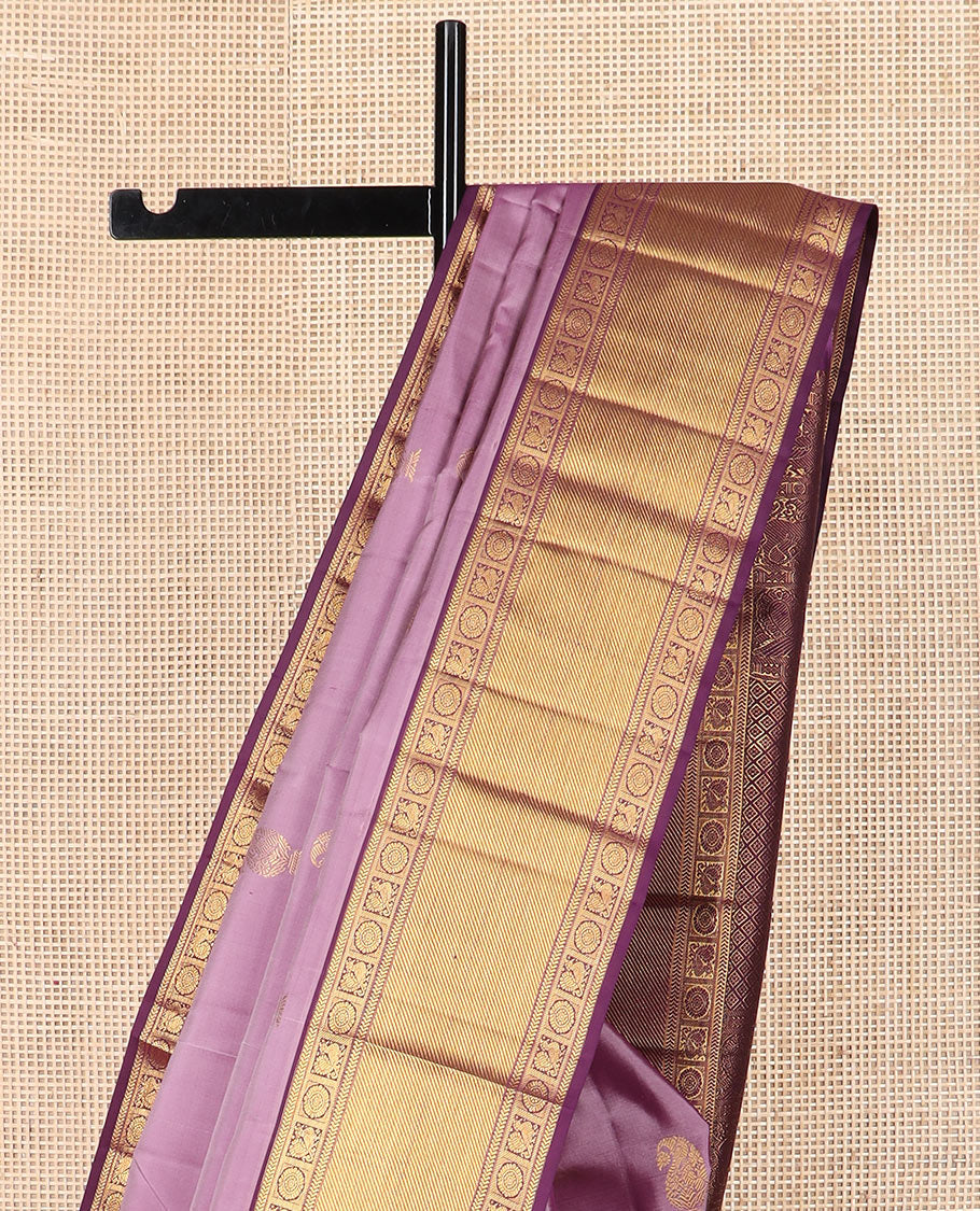 Purple manga buttas Kanchipuram silk saree, contrast border of kathir,  and annam chakram designs, and zari-rich jaal pallu