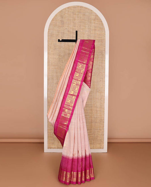 Pink kancheepuram silk saree with zari buttas, contrast thazhampoo reku one-sided border of salngai, banaras, mayil & chakram designs & floral design pallu
