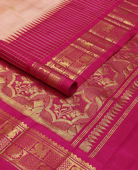 Pink kancheepuram silk saree with zari buttas, contrast thazhampoo reku one-sided border of salngai, banaras, mayil & chakram designs & floral design pallu