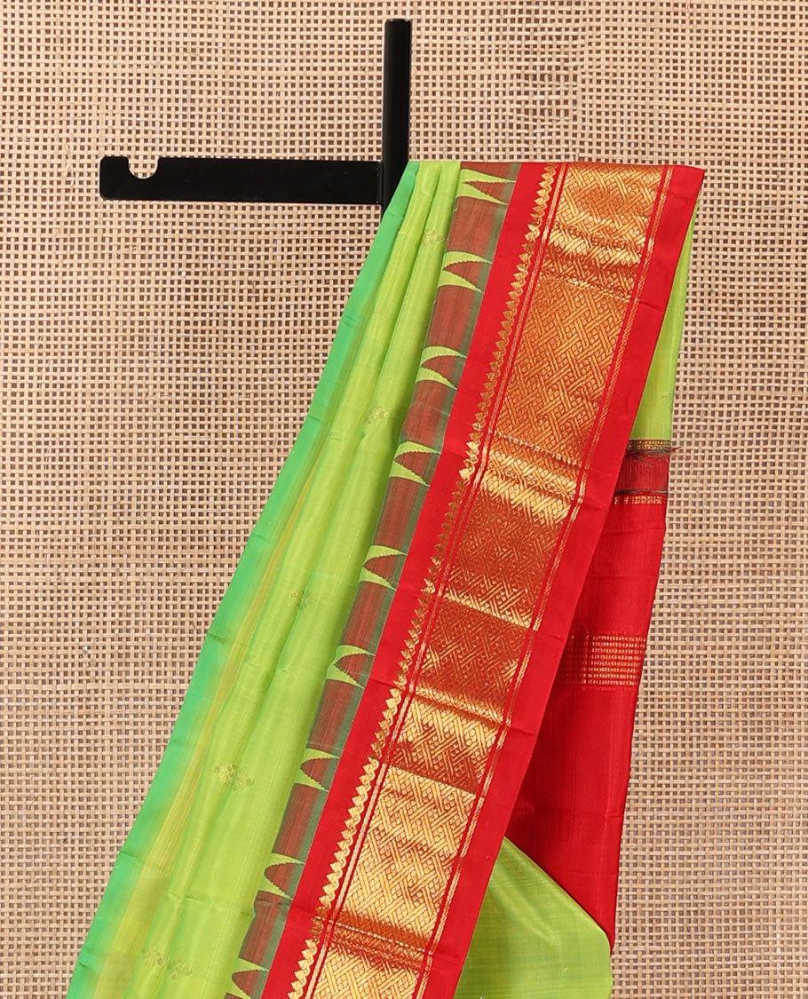 Parrot green zari buttas Kanchipuram silk saree, contrast one-sided thazampoo rekku traditional zari border, and zari design pallu
