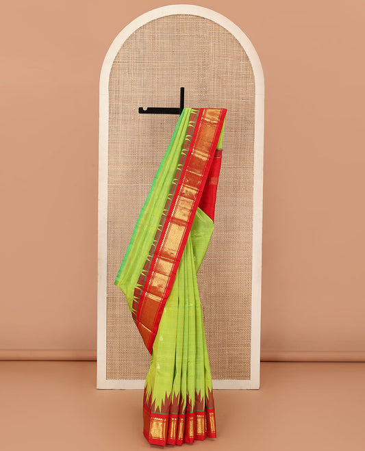 Parrot green zari buttas Kanchipuram silk saree, contrast one-sided thazampoo rekku traditional zari border, and zari design pallu