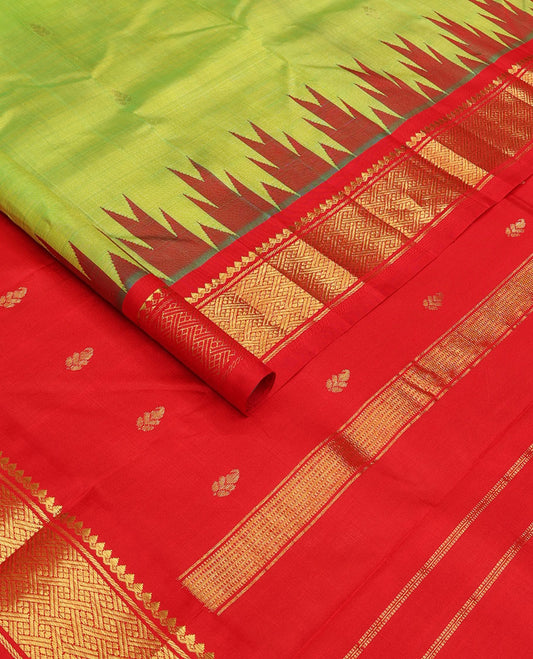 Parrot green zari buttas Kanchipuram silk saree, contrast one-sided thazampoo rekku traditional zari border, and zari design pallu