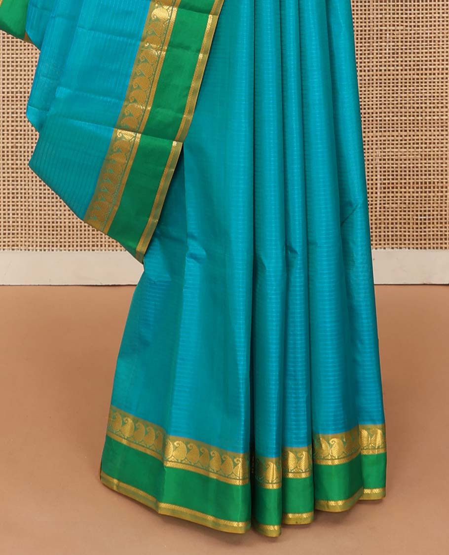 Blue striped Kanchipuram silk saree, contrast rettai pettu border of vanki manga, and kathir designs, and zari design pallu