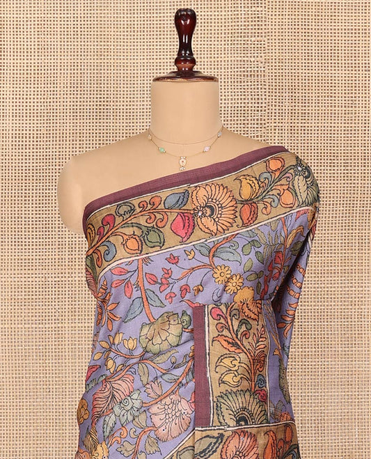 Lavender Semi-Tussar Saree Artfully Printed with Kalamkari-Style Colorful Floral Print, Complemented by a Contrast Floral Printed Border, Pallu Depicting Krishna and Gopis Print, and Paired with a Contrast Printed Blouse