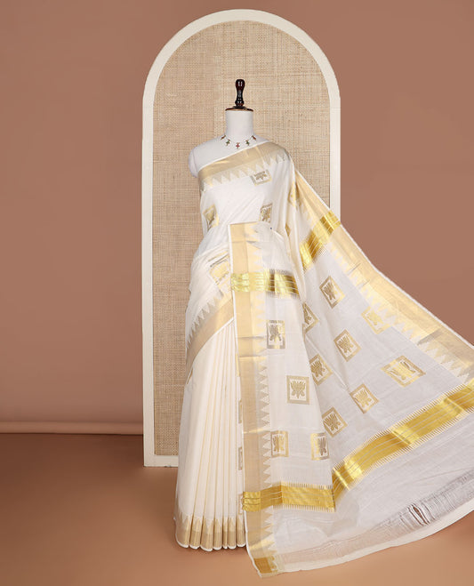 Cream zari Pichwai lotus buttas Kerala saree, zari temple border, and pallu of Pichwai lotus motifs