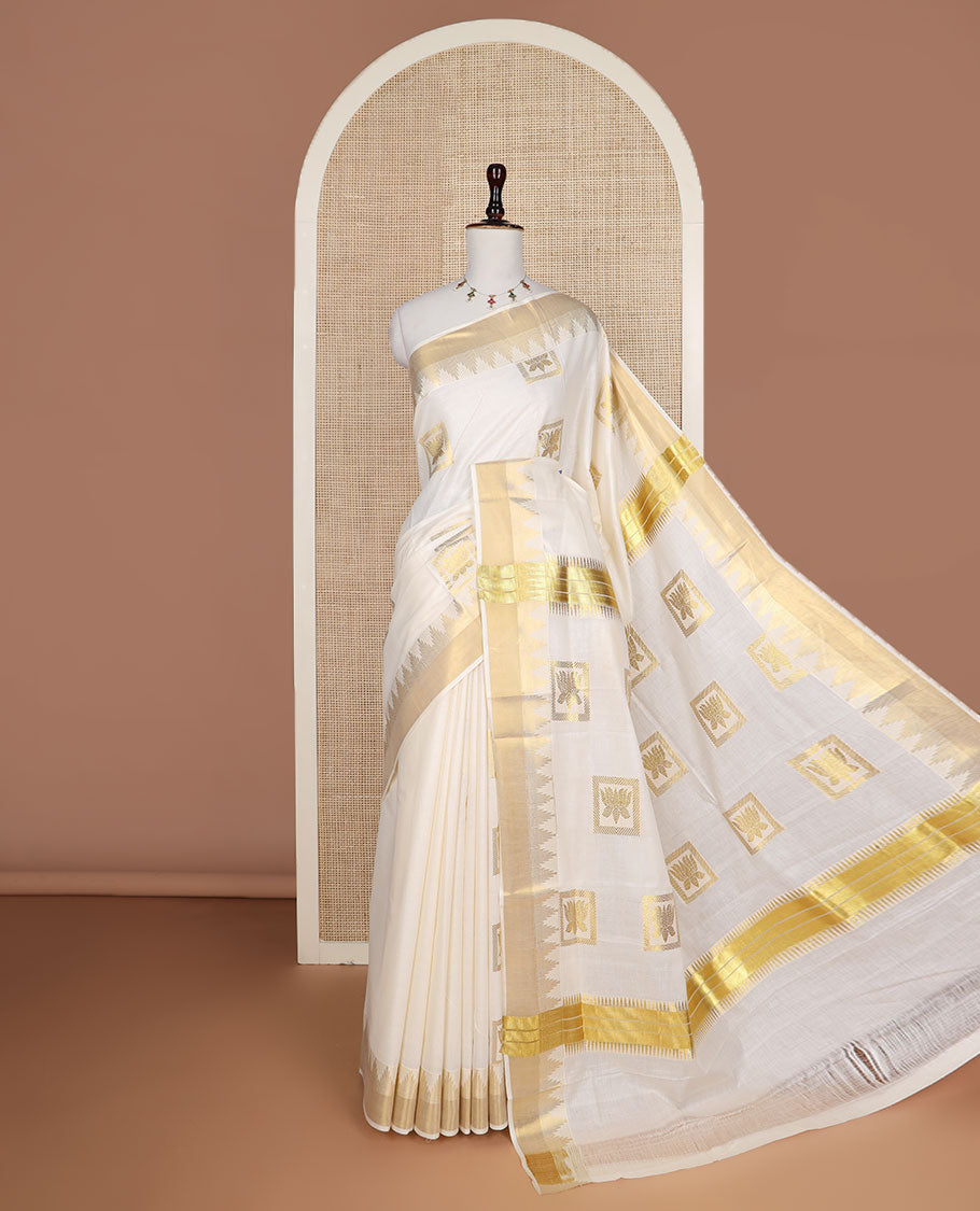 Cream zari Pichwai lotus buttas Kerala saree, zari temple border, and pallu of Pichwai lotus motifs