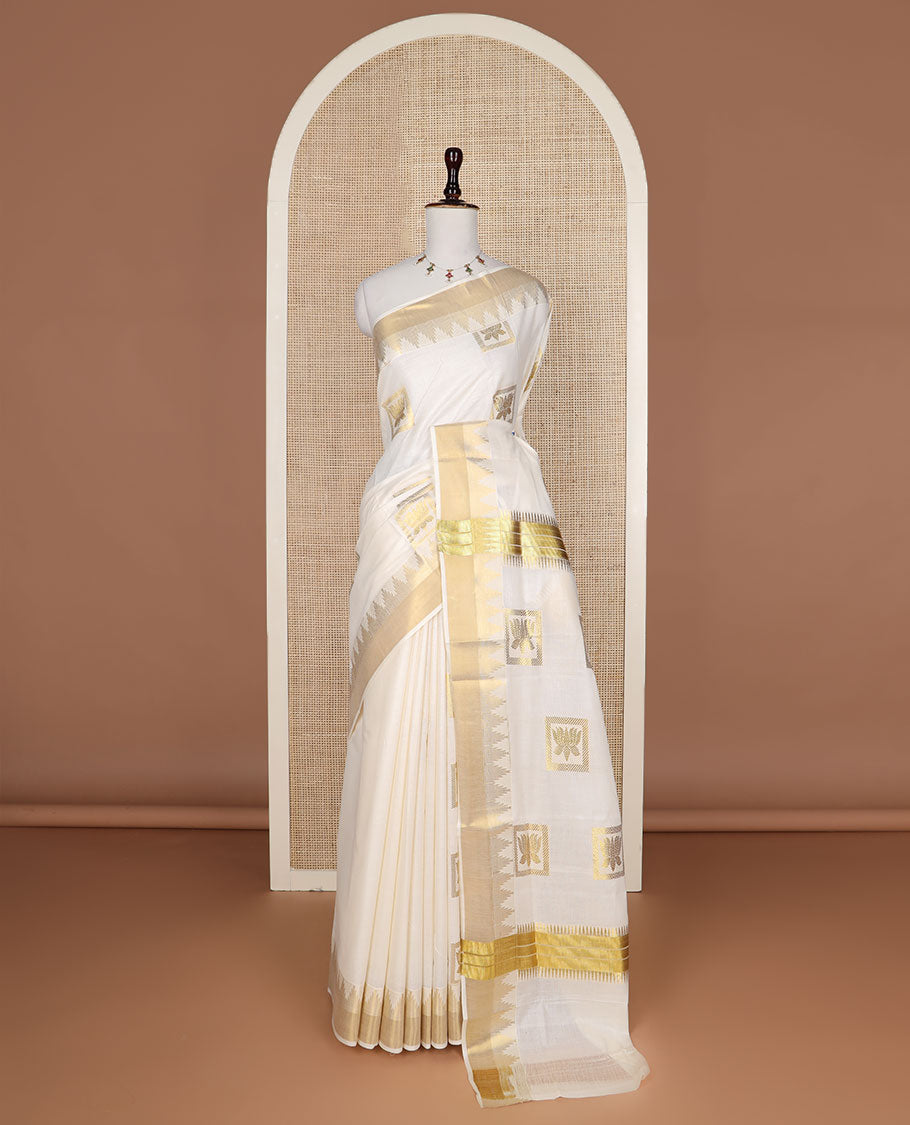 Cream zari Pichwai lotus buttas Kerala saree, zari temple border, and pallu of Pichwai lotus motifs