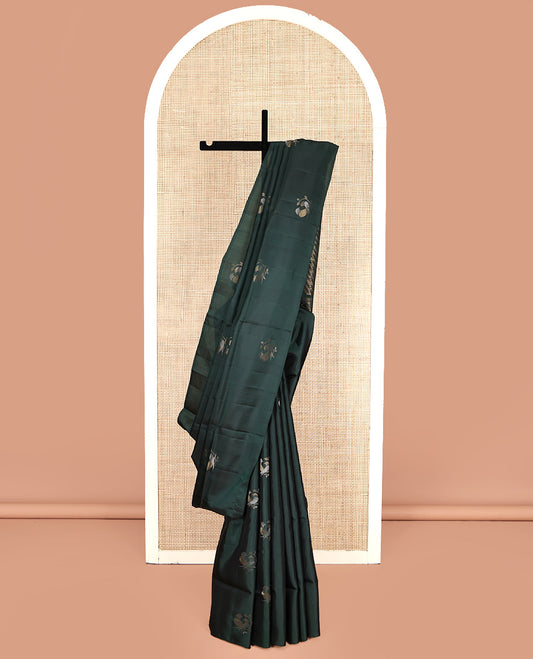 Borderless Green Mayuri Lite Silk Mix Saree, Detailed with Bird Buttas All Over Its Body, Highlighted by a Zari Pallu of Diagonal Stripes and Chakram Designs, and Paired with a Matching Blouse