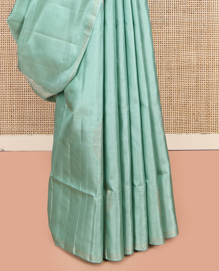 Pale Green Mayuri Soft Silk Saree, Beautifully Bedecked with Kili Buttas, a Subtle Piping Border, Sparsely Woven Pallu, and a Matching Blouse