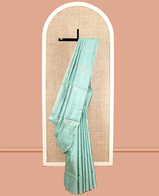Pale Green Mayuri Soft Silk Saree, Beautifully Bedecked with Kili Buttas, a Subtle Piping Border, Sparsely Woven Pallu, and a Matching Blouse