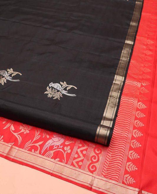Black Mayuri Soft Silk Saree, Accentuated with Bird Buttas All Over Its Body, Subtle Zari Piping Border, Complemented by Contrast Pallu of Floral-Bird Jaal Designs, and Paired with Contrast Blouse