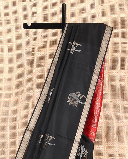 Black Mayuri Soft Silk Saree, Accentuated with Bird Buttas All Over Its Body, Subtle Zari Piping Border, Complemented by Contrast Pallu of Floral-Bird Jaal Designs, and Paired with Contrast Blouse