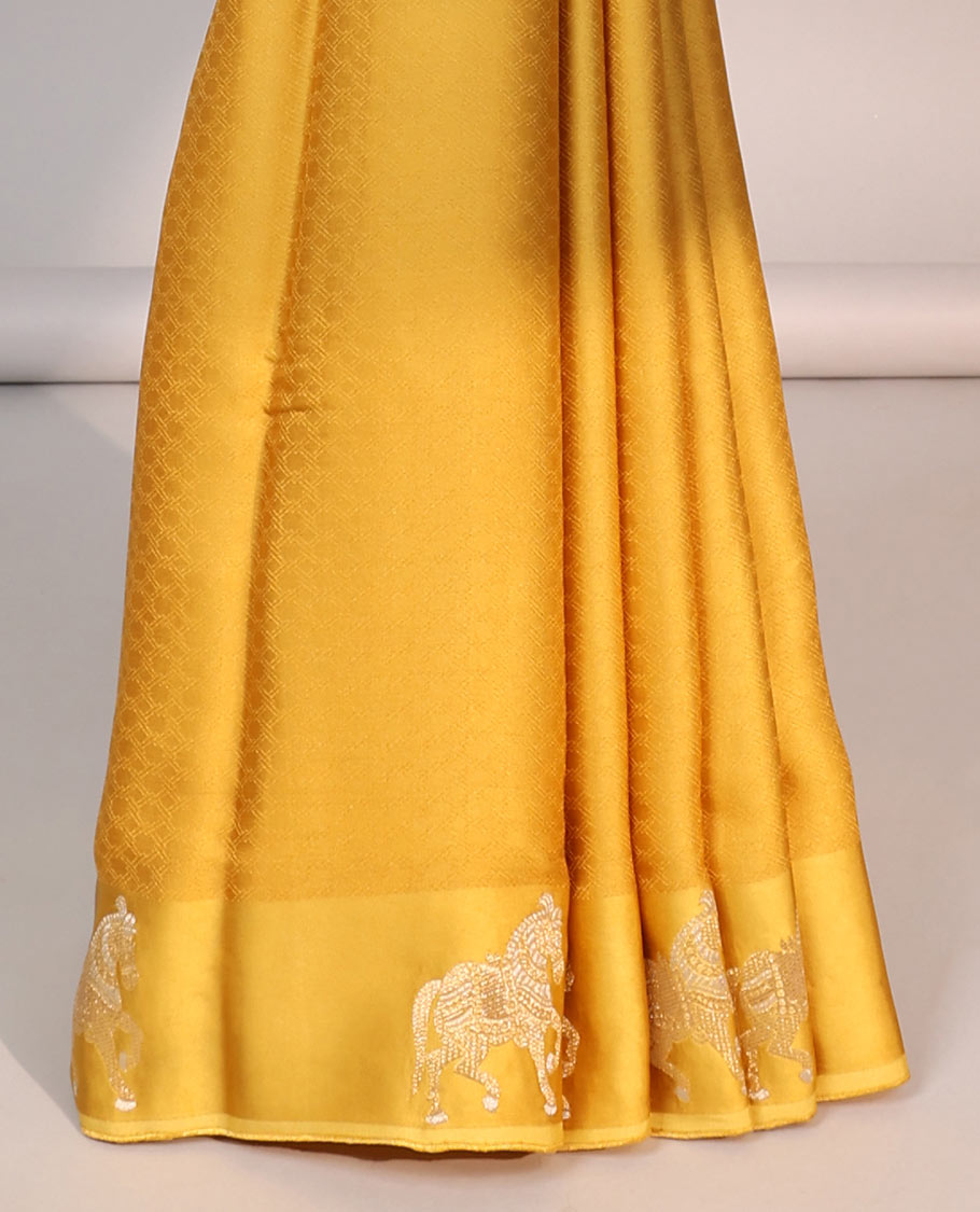 Yellow mushru silk saree with contrast horse motifs border & intricate zari design pallu